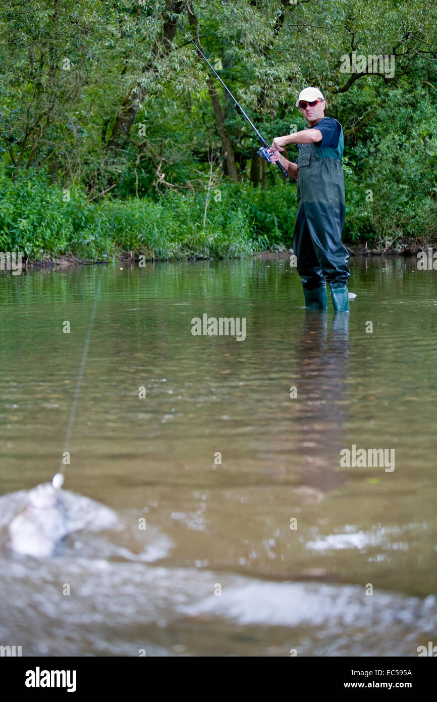 a angler fishing in the river Stock Photo