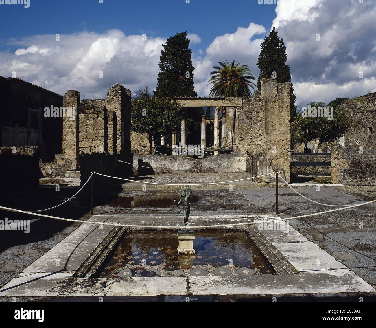 Roman Art. Italy. Pompeii. The House of the Faun. Built during the 2nd century BC. Private residence. Bronze statue of the dancing faun located, originally, on the lip of the impluvium. Stock Photo