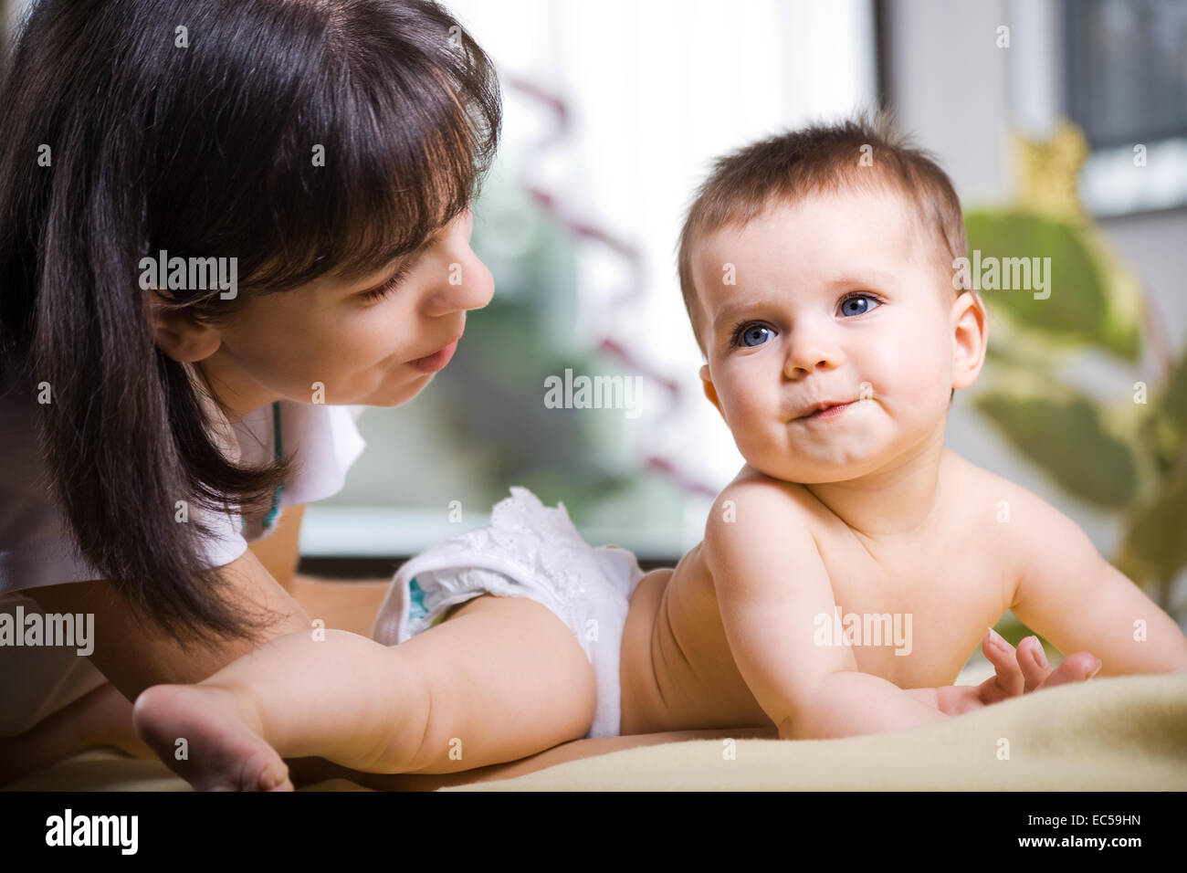 a 6 month old baby in front of nursery and the mother Stock Photo Alamy