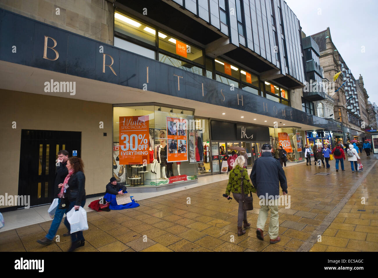 BRITISH HOME STORES department store with homeless beggar outside on Princes Street Edinburgh Scotland UK Stock Photo