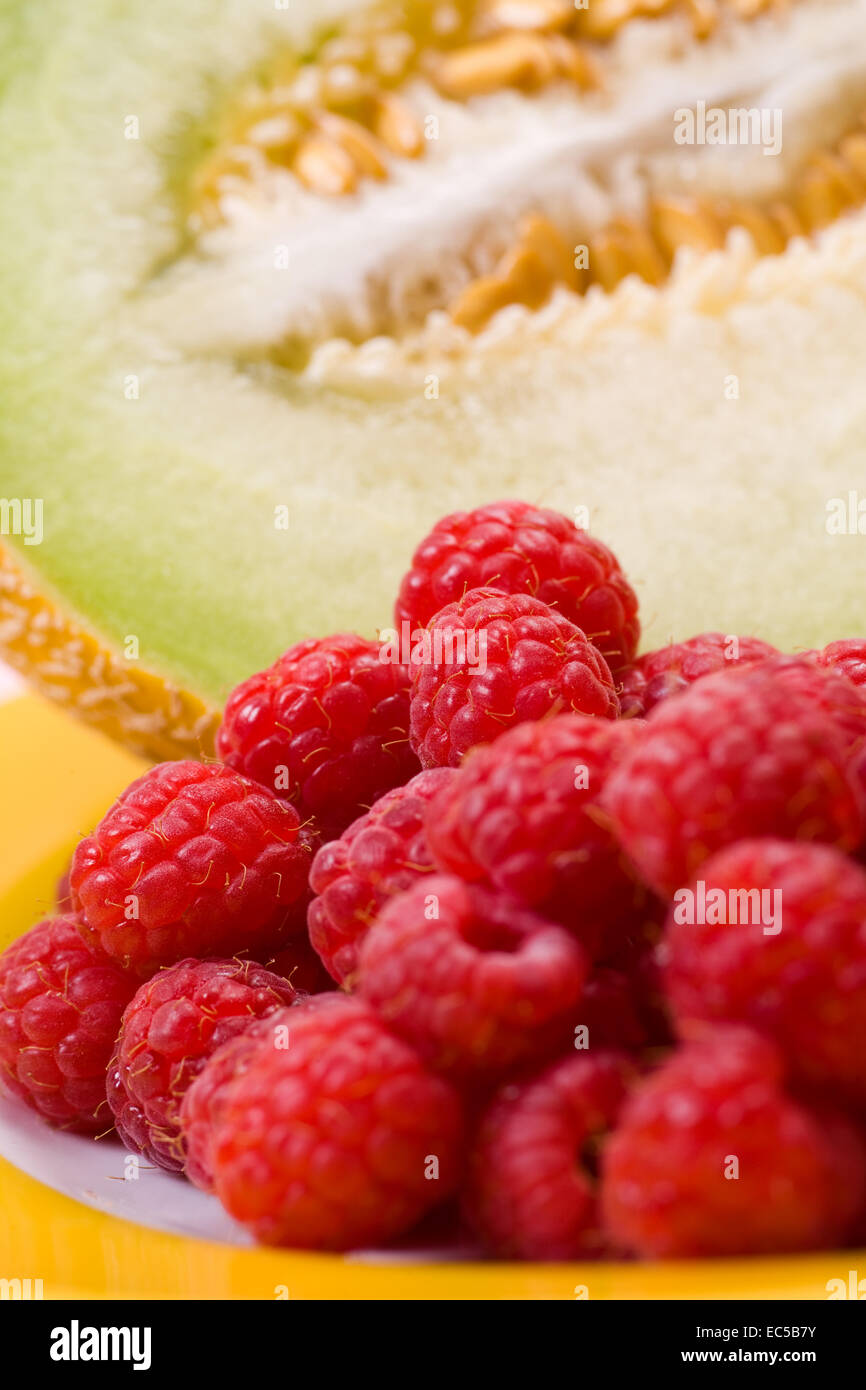 Raspberry Melon a plate with raspberries and melon Stock Photo - Alamy