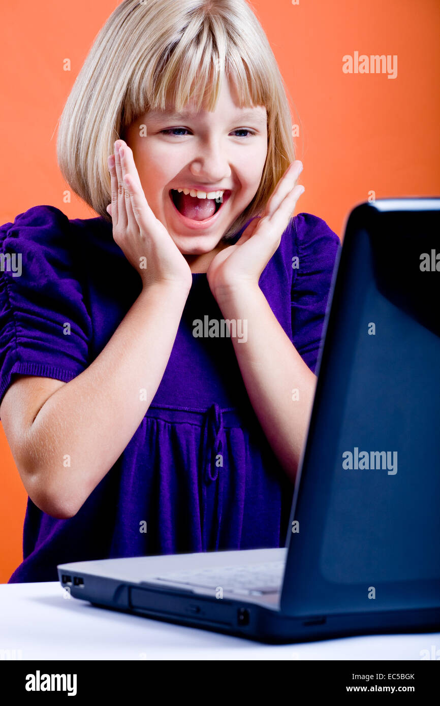 surprised teen girl with laptop Stock Photo - Alamy