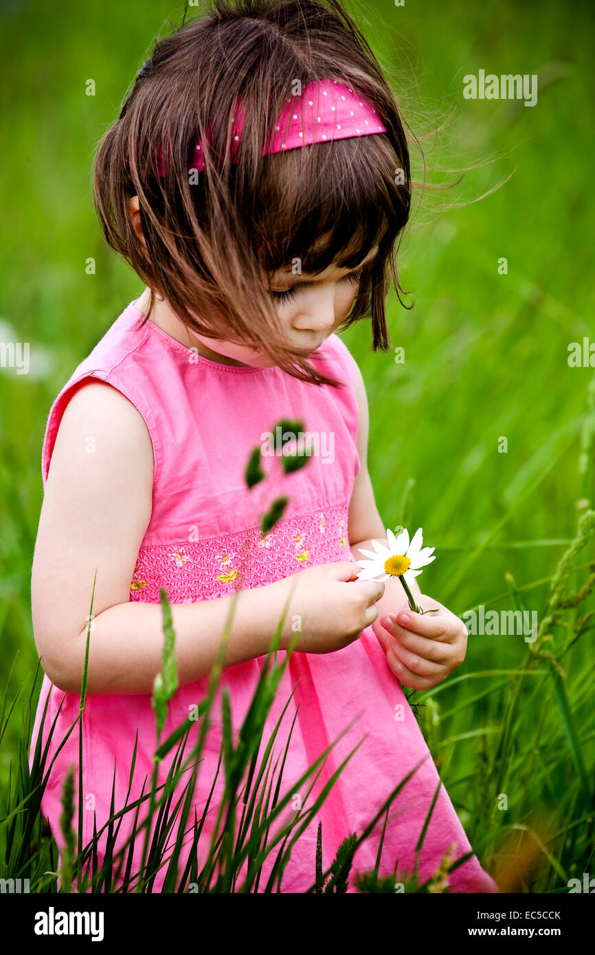 little girls walking and ranking the fields Stock Photo - Alamy