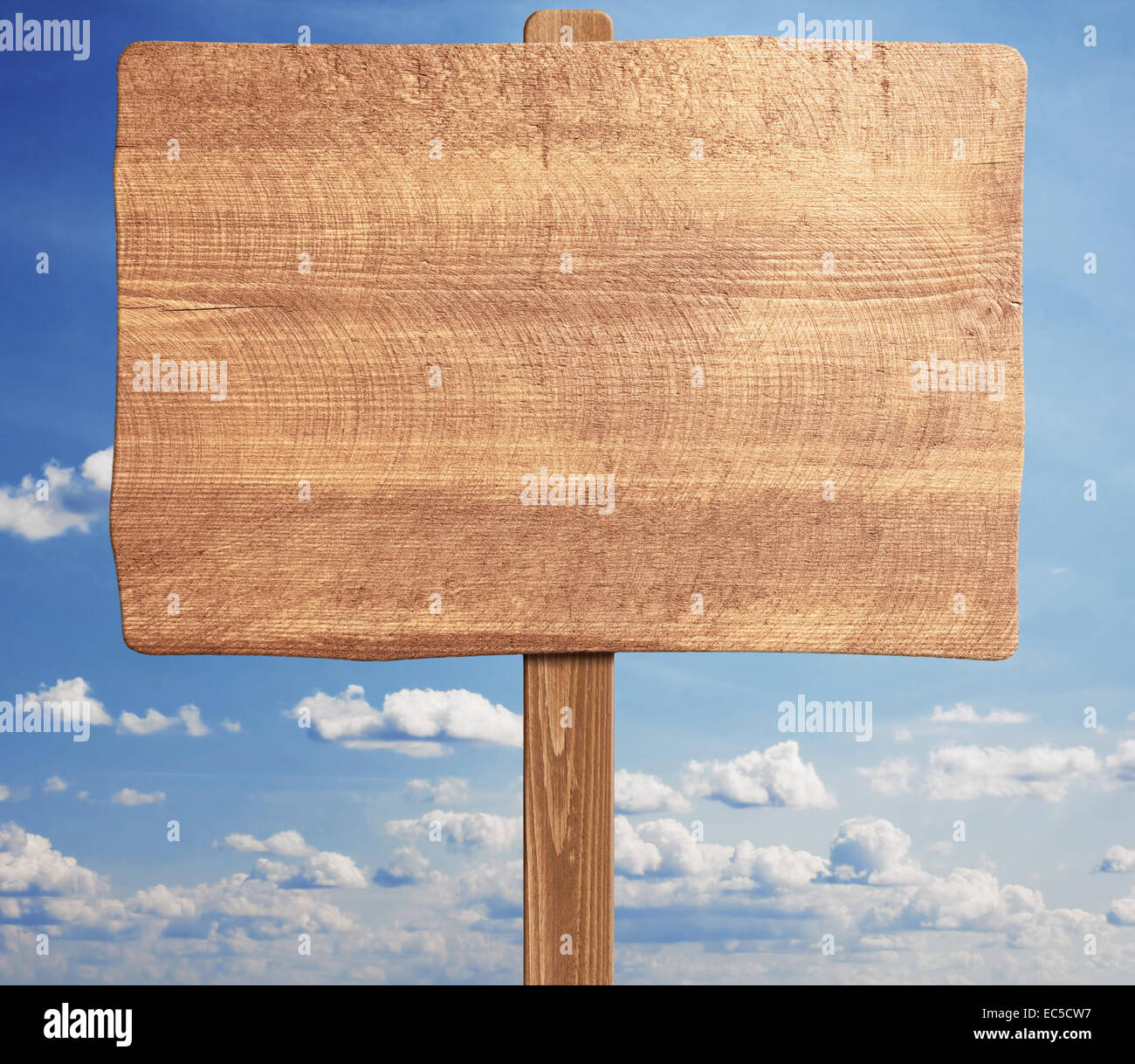 Blank brown wooden signpost against blue sky Stock Photo - Alamy