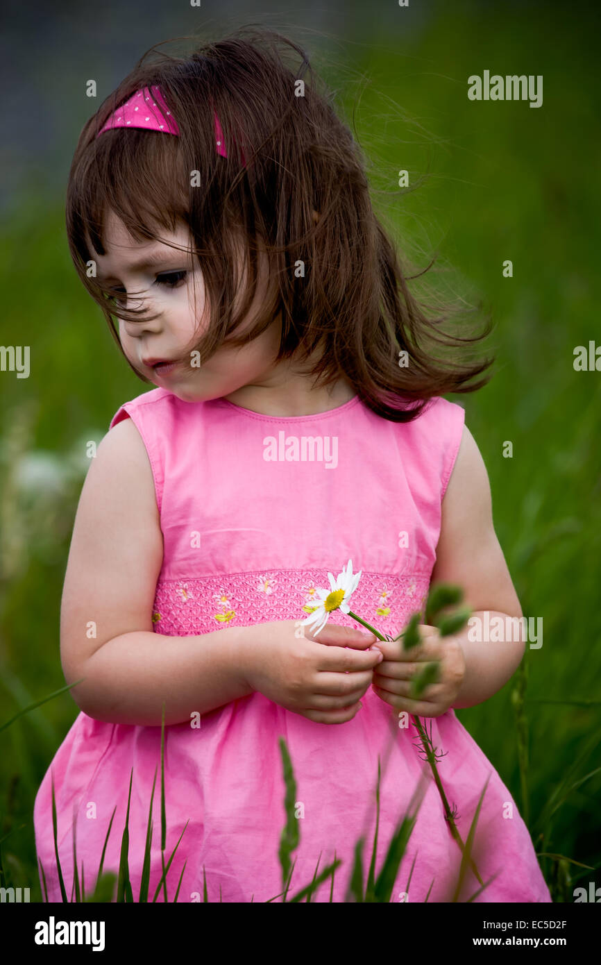 little girls walking and ranking the fields Stock Photo - Alamy