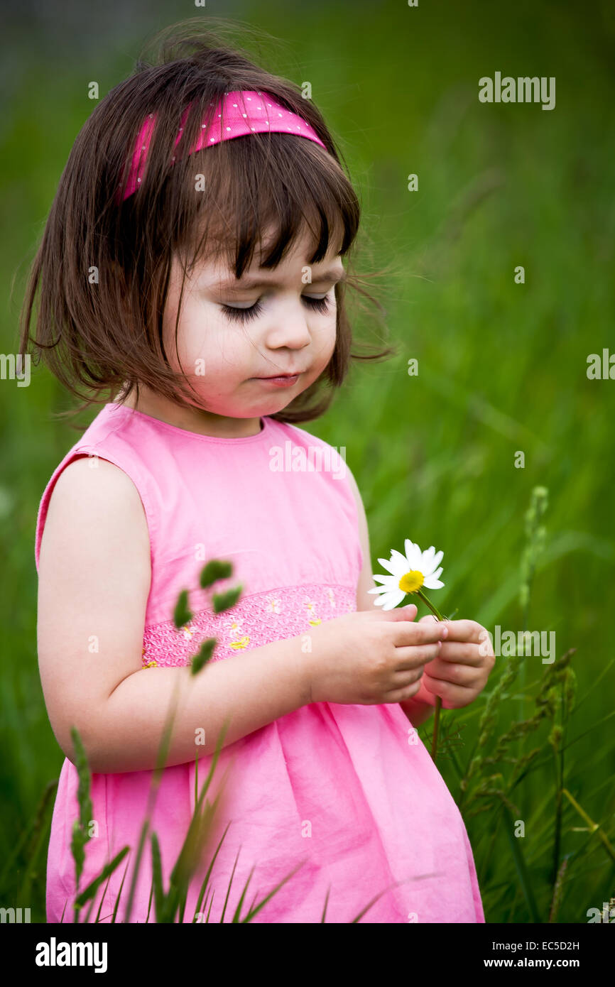 little girls walking and ranking the fields Stock Photo - Alamy