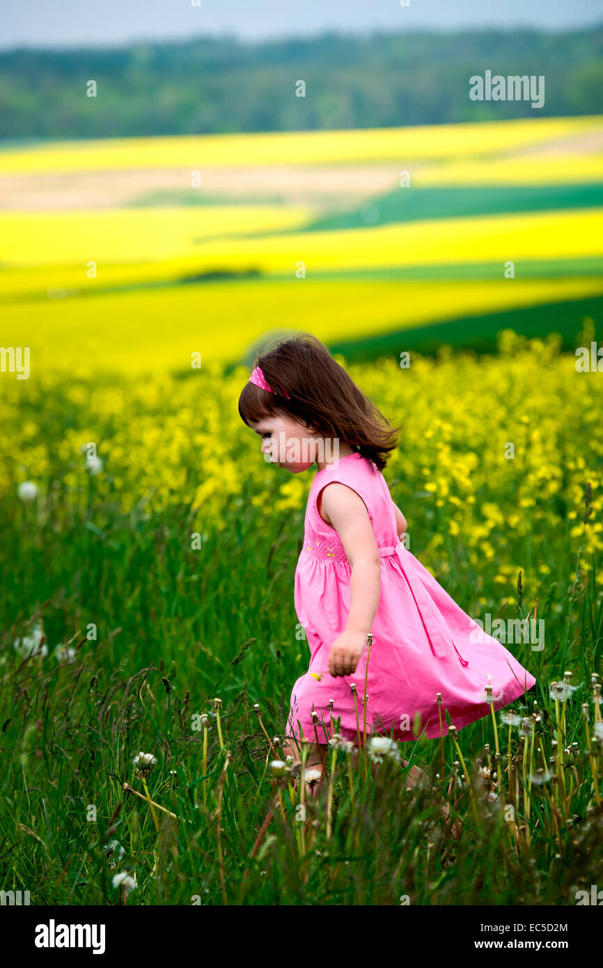 little girls walking and ranking the fields Stock Photo - Alamy