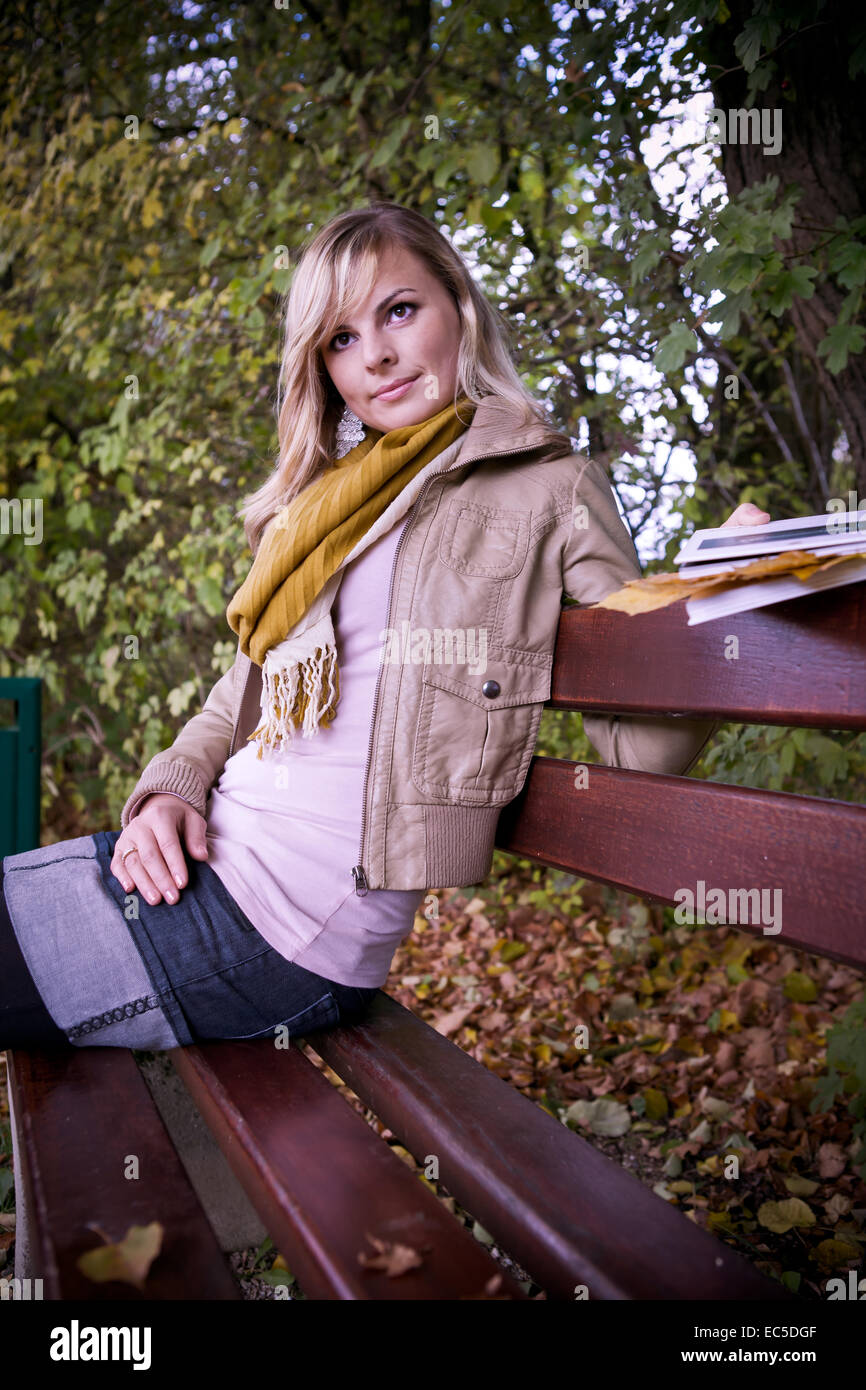 portrait of a young woman in the autumn park Stock Photo - Alamy