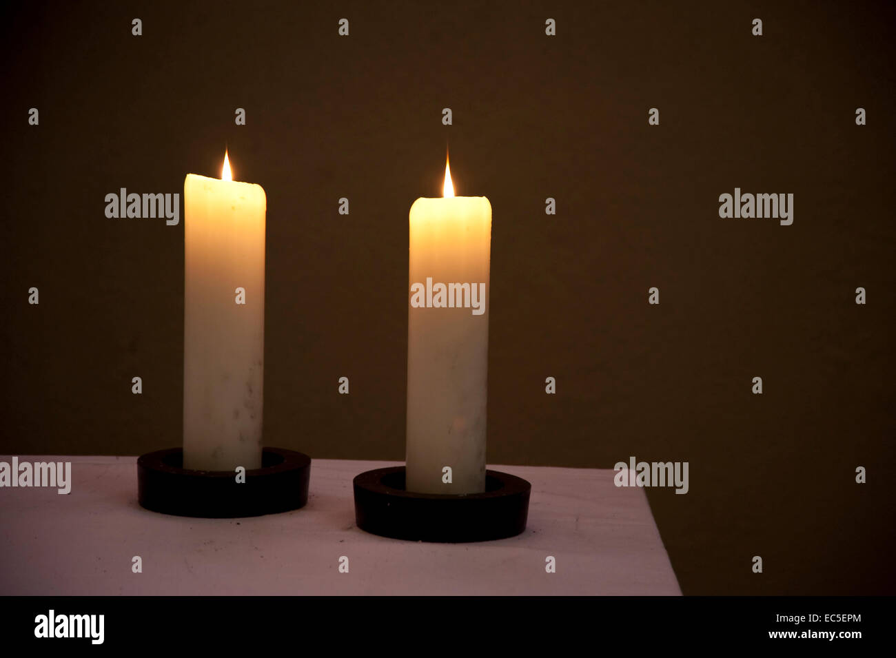 Two candles on an altar Stock Photo Alamy