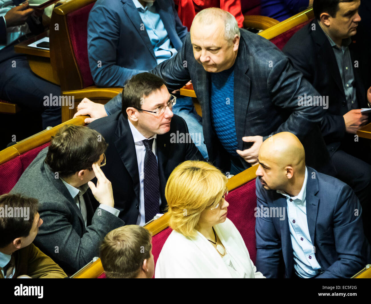 Kiev, Ukraine. 9th December, 2014. The head of the Bloc Poroshenko in Parliament Yuriy Lutsenko speaks with deputy journalist Mustafa Naem  --  Oleg Lyashko faction blocked the rostrum demanding an immediate vote a resolution on dismissal of the Chairmanship of the Committee of former members of the Party of Regions, which voted in favor of dictatorial laws of January 16. Oleg Lyashko spoke from the podium: 'It is the law of January 16 led to bloodshed on the Maidan, and for this reason, these members are not eligible to participate in nation-build Credit:  Igor Golovnov/Alamy Live News Stock Photo