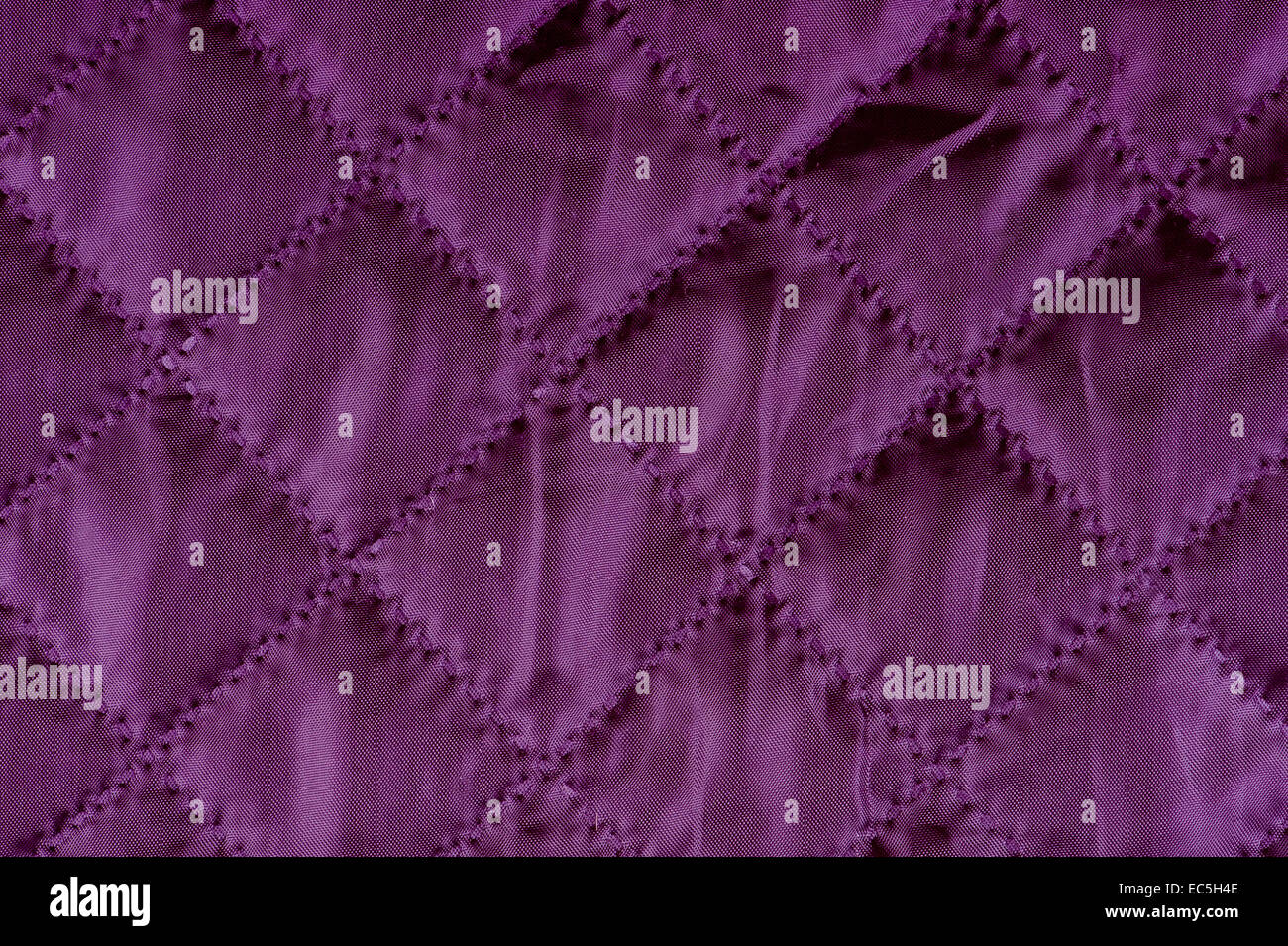 Purple quilted cloth texture abstract Stock Photo