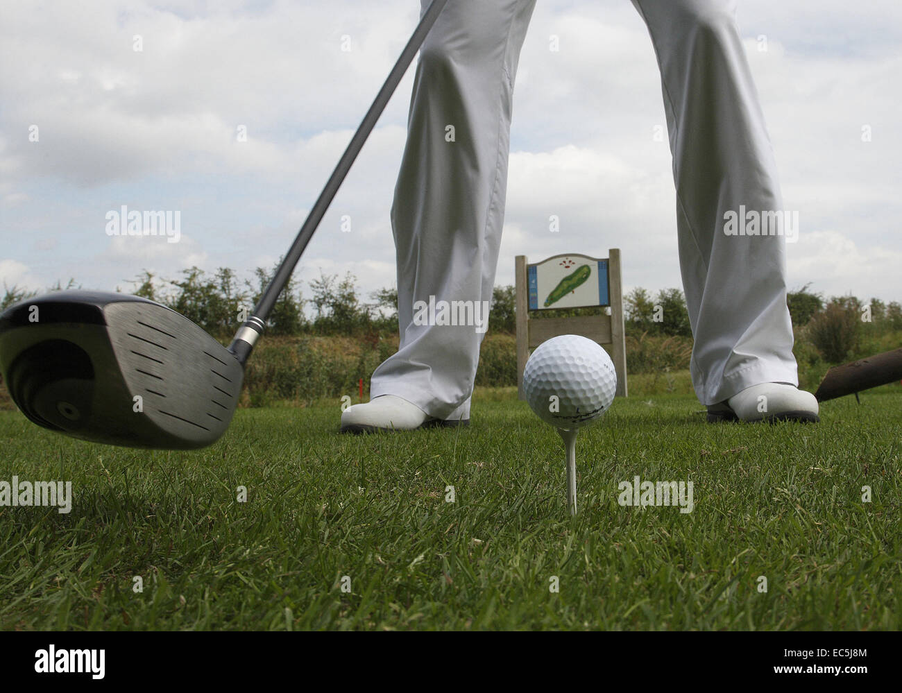 Golfclub hits golfball Stock Photo