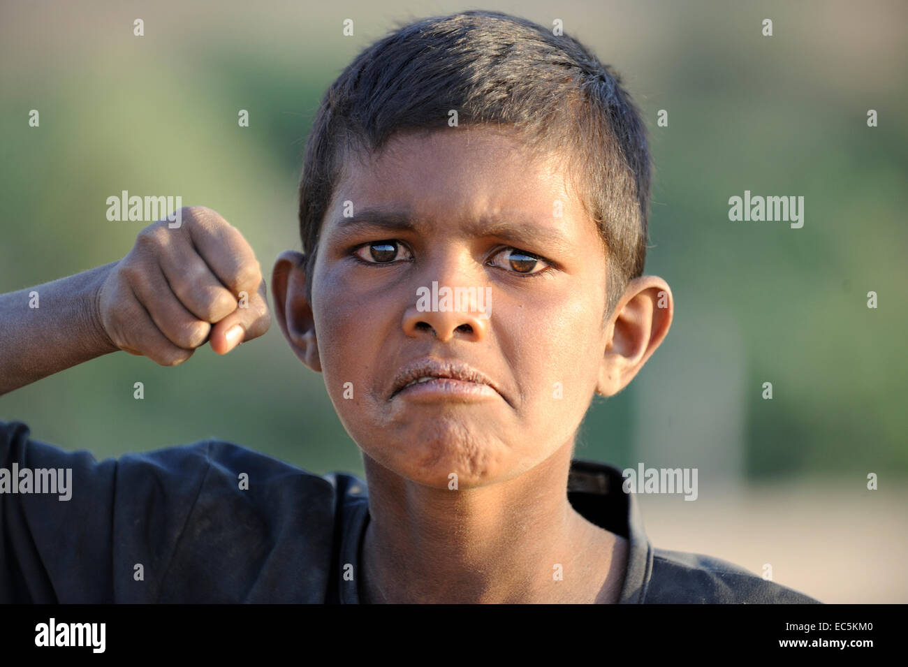 Funny indian boy give punch Stock Photo - Alamy