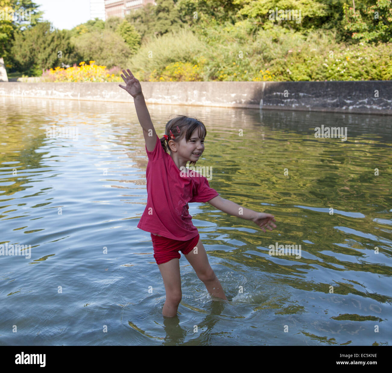 The little girl playing in the water Stock Photo - Alamy