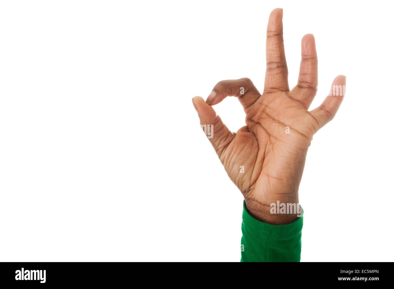 Dark fingers form the ok sign Stock Photo