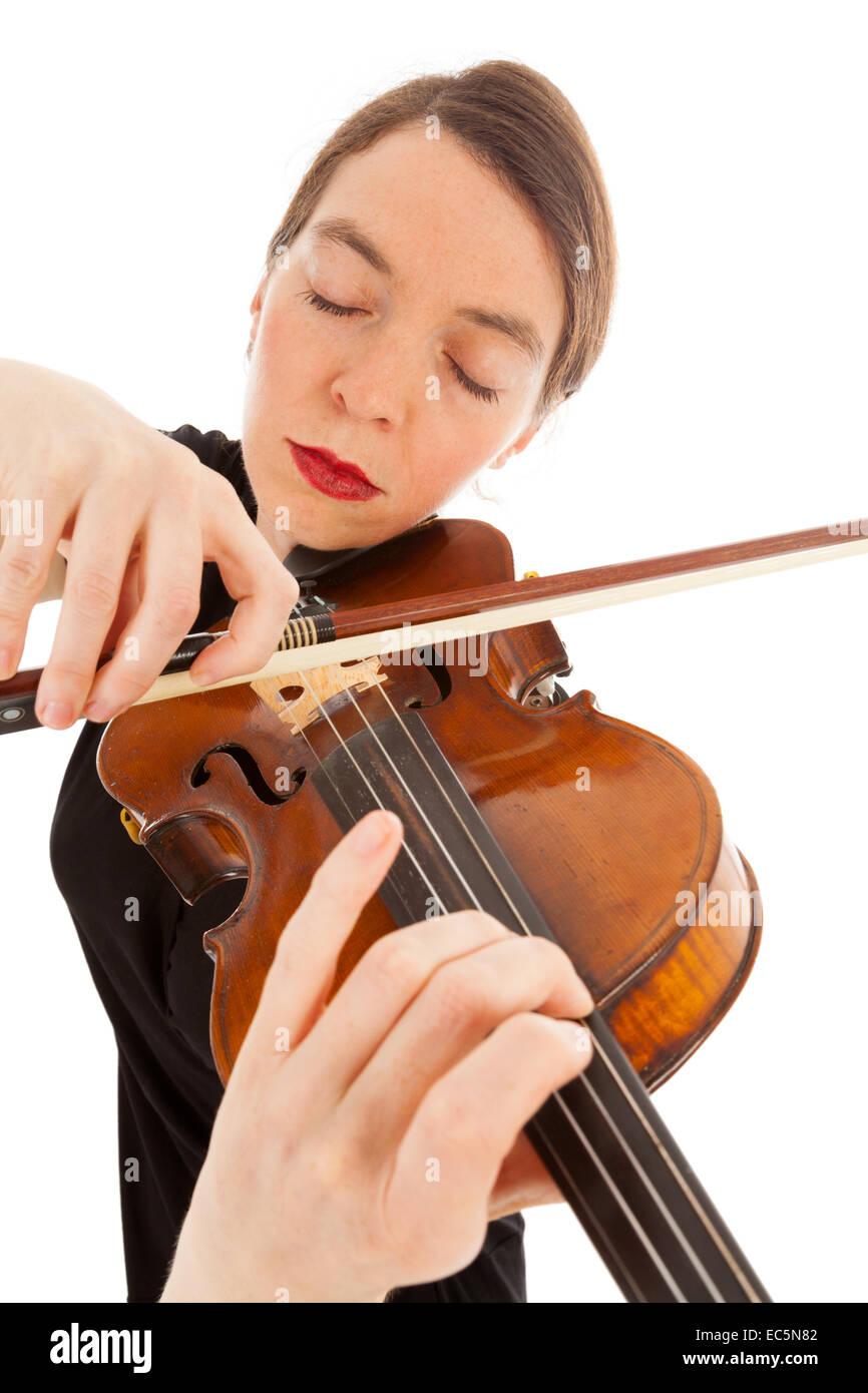 The beautiful young woman is playing the violin Stock Photo - Alamy