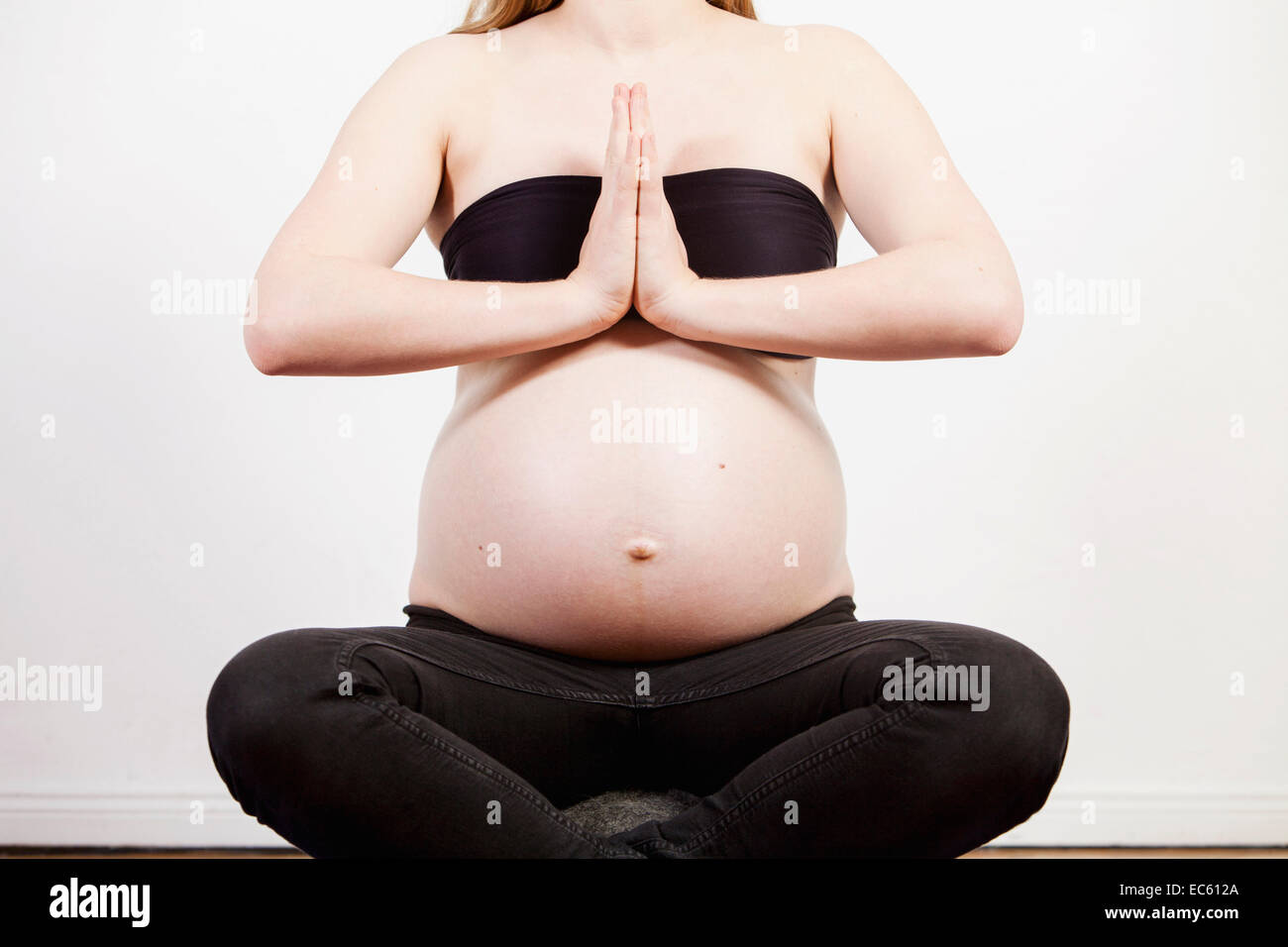 Young pregnant woman sitting and meditate meditation peace balance balance yoga belly baby bump