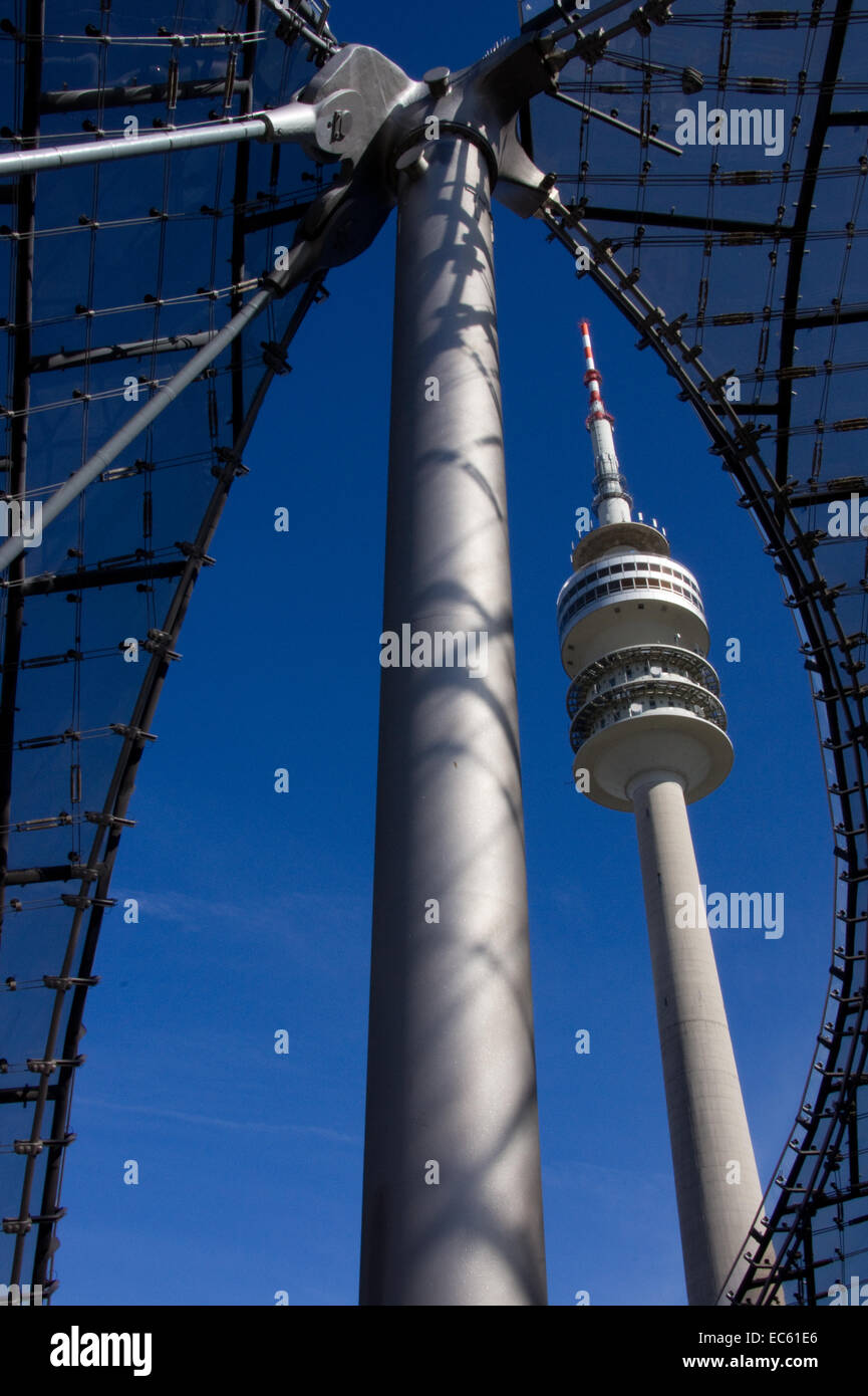 Munich TV tower viewed through the tent shaped roof of the olympic ...