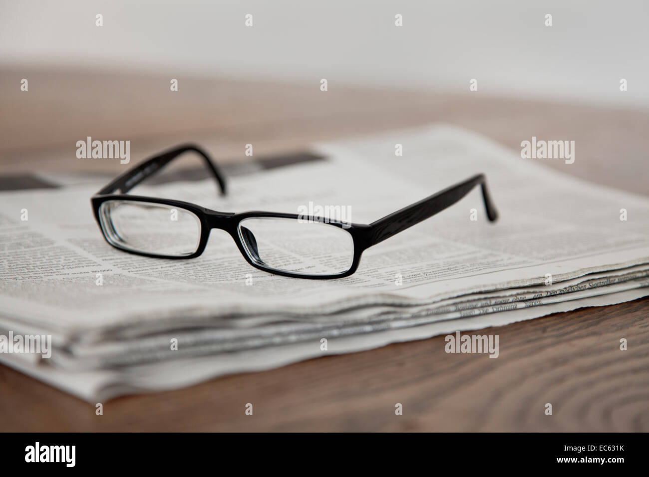 Glasses on a newspaper Stock Photo Alamy