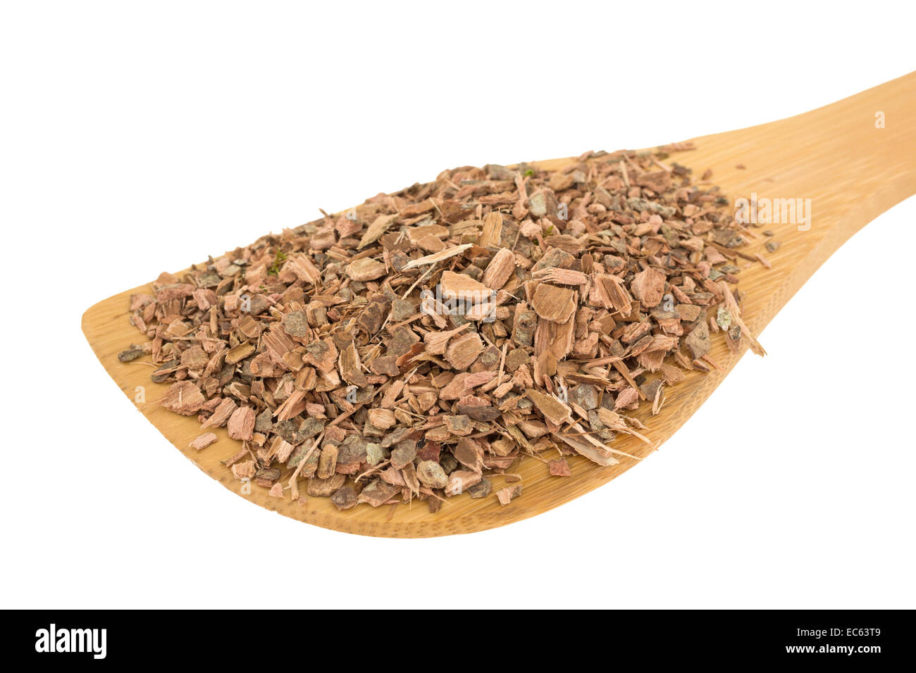 A wood spoon filled with witch hazel bark on a white background. Stock Photo