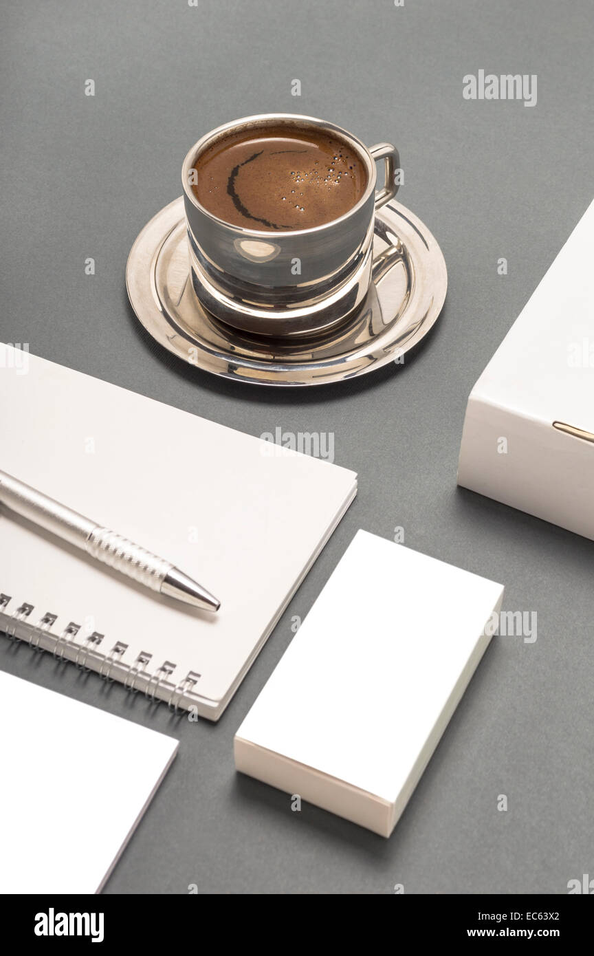 Blank stationery set : coffee cup, business cards, booklet, sheets, notebook, CD, boxes and pencil. Stock Photo