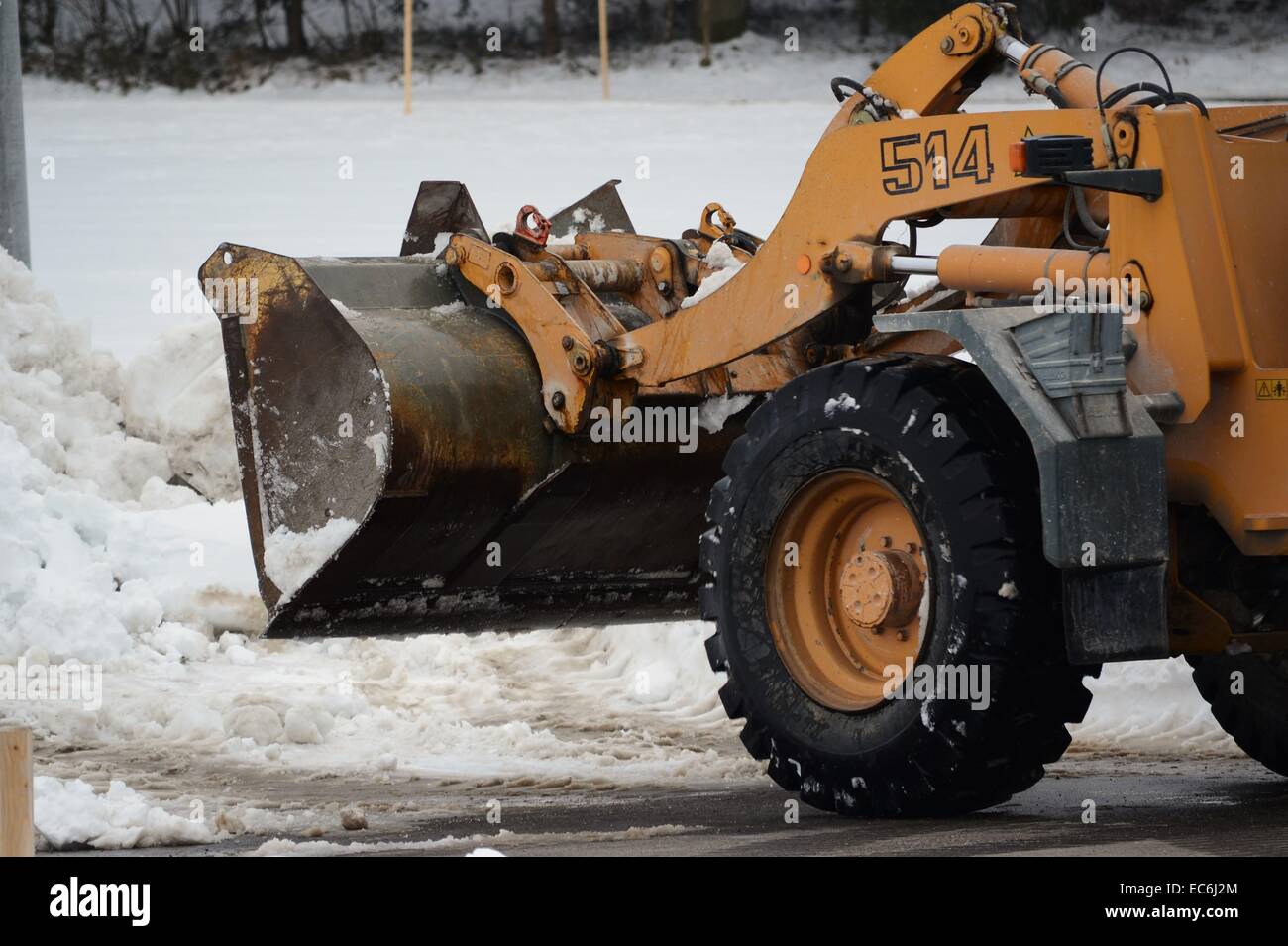 Excavator clears snow Stock Photo