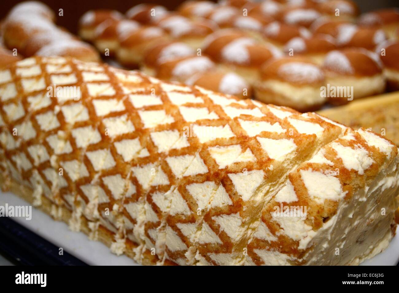 Swiss roll and donuts Stock Photo