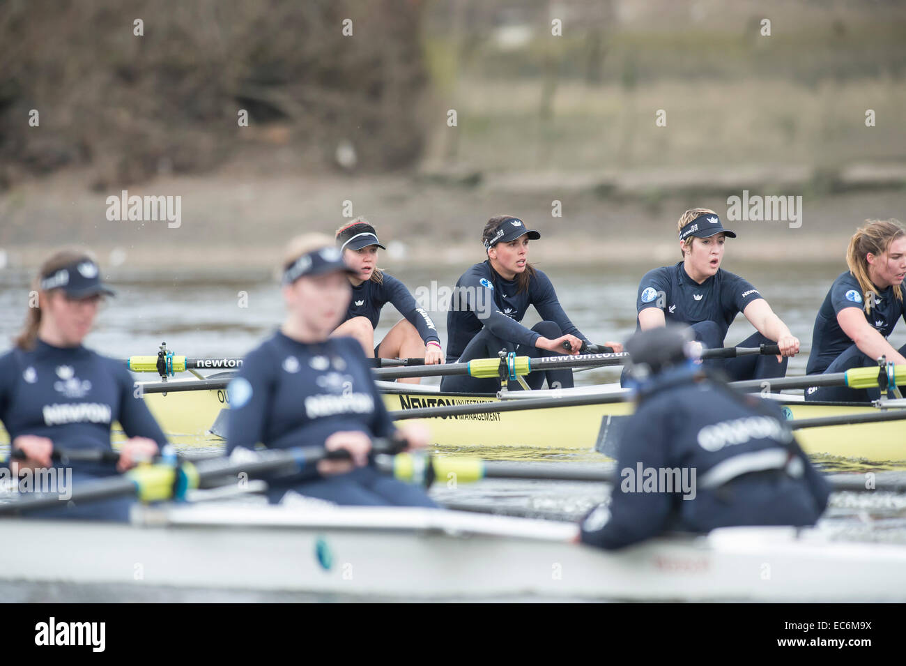 River Thames, London, UK. 9th December, 2014. Putney (start) and Mortlake.      Oxford Race.   REAL LIFE, (yellow hull) Bow Maxie Scheske, 2 Lucinda Foote-Short, 3 Katie Davidson, 4 Georgia Daniell, 5 Nadine Gradel Iberg, 6 Emily Reynolds, 7 Maddy Badcott, Stroke Lauren Kedar, Cox Ayesha Rasheed,   FANTASY, (white hull) Bow Caroline Greves, 2 Anastasia Chitty, 3 Abigail Cottingham, 4 Elo Luik, 5 Alice Ca Credit:  Duncan Grove/Alamy Live News Stock Photo