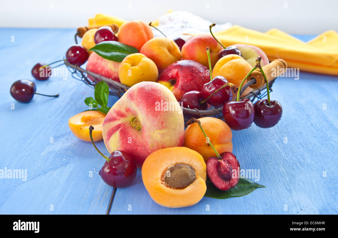 Variety of peach fruits and cherries Stock Photo Alamy