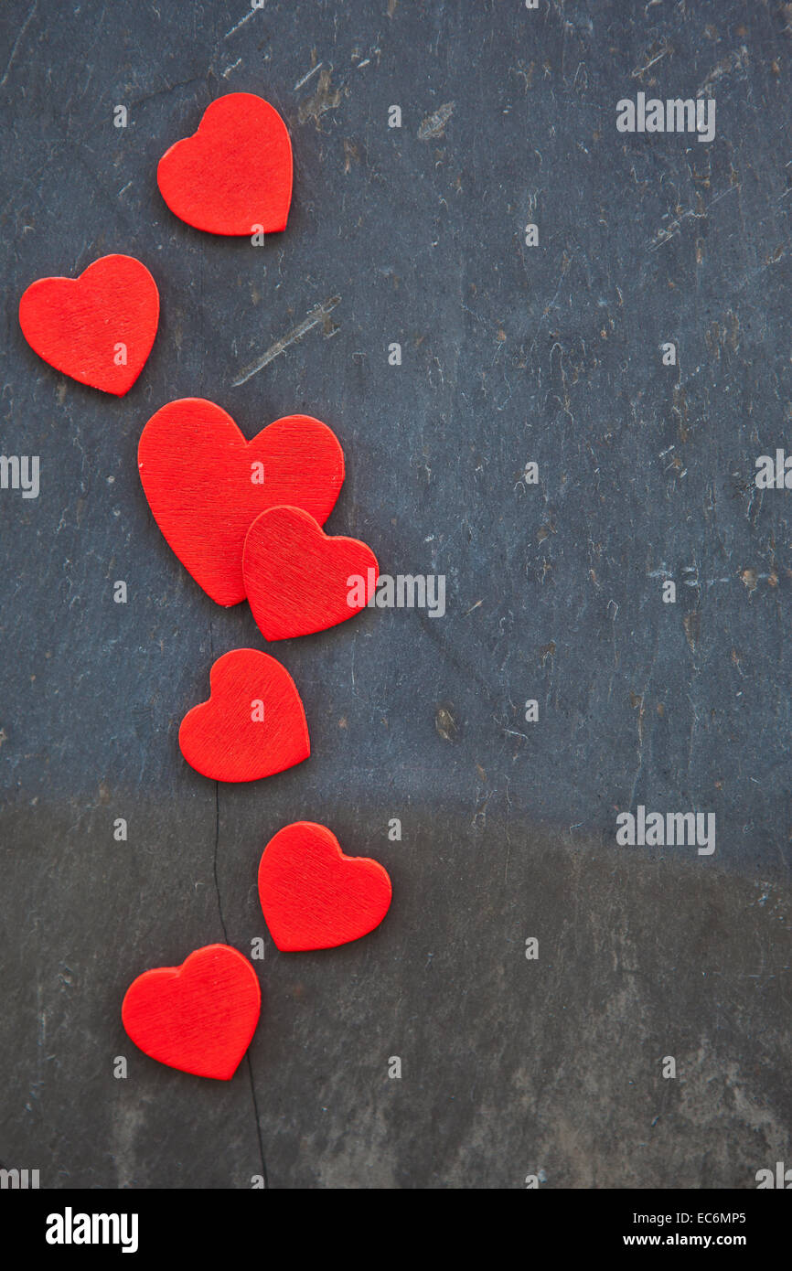 Stone background with red hearts Stock Photo