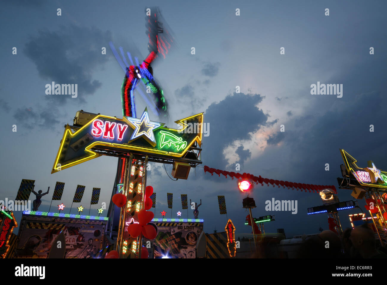 ride carousel fairs carnivals festival light strips in the evening