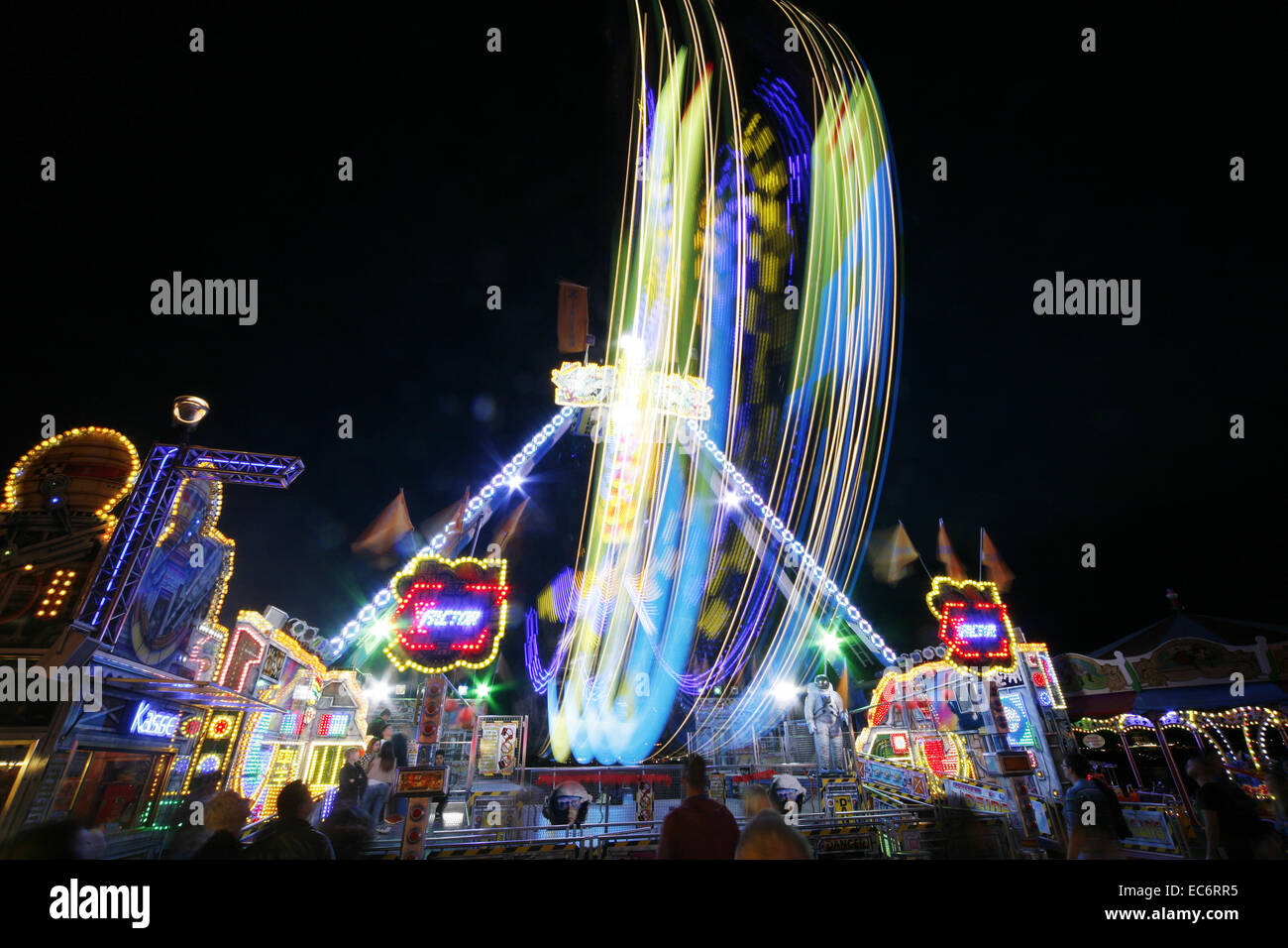 ride carousel fairs carnivals festival light strips in the evening