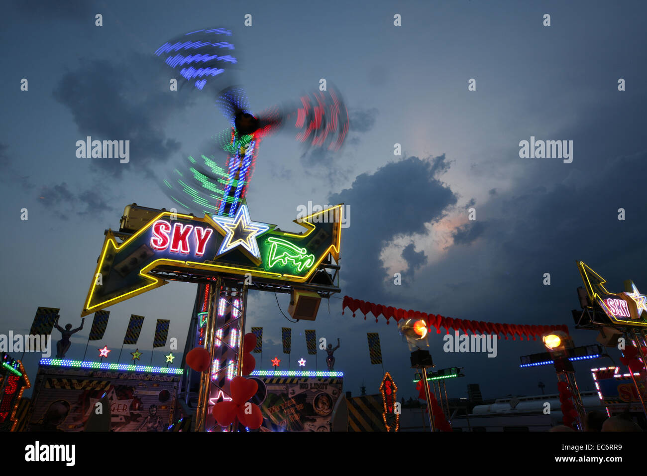 ride carousel fairs carnivals festival light strips in the evening