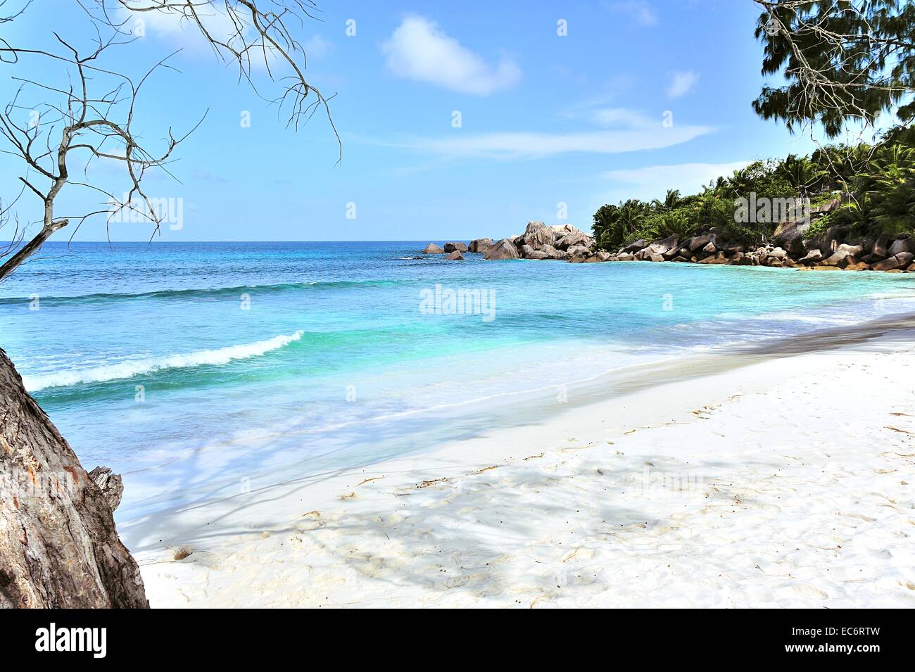 White sandy beach Anse Cocos on the island La Digue, Seychelles Stock Photo