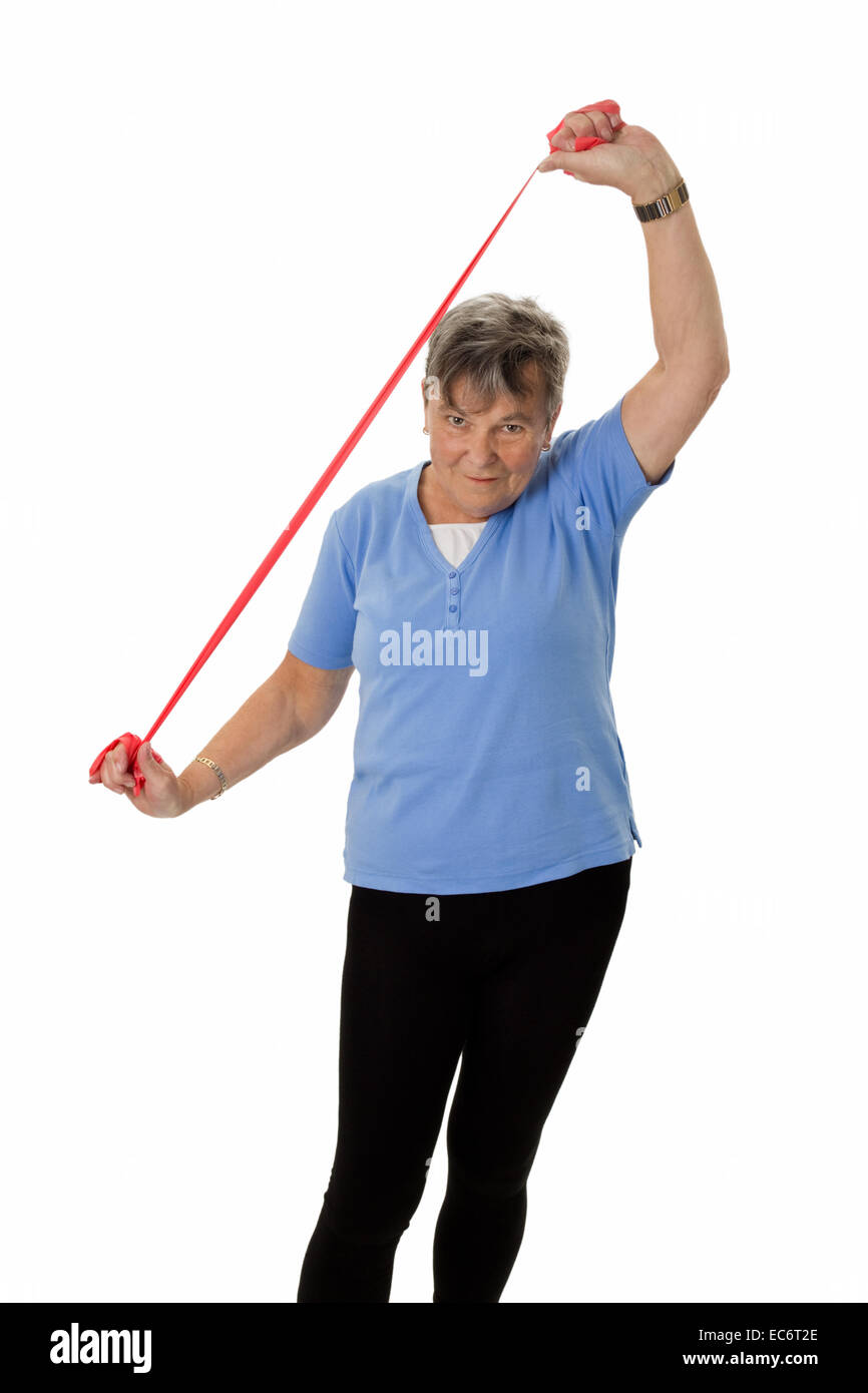 Senior woman exercising with rubber band Stock Photo Alamy