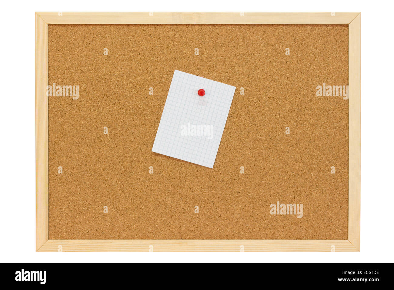 White note with red pushpin on a pin board Stock Photo