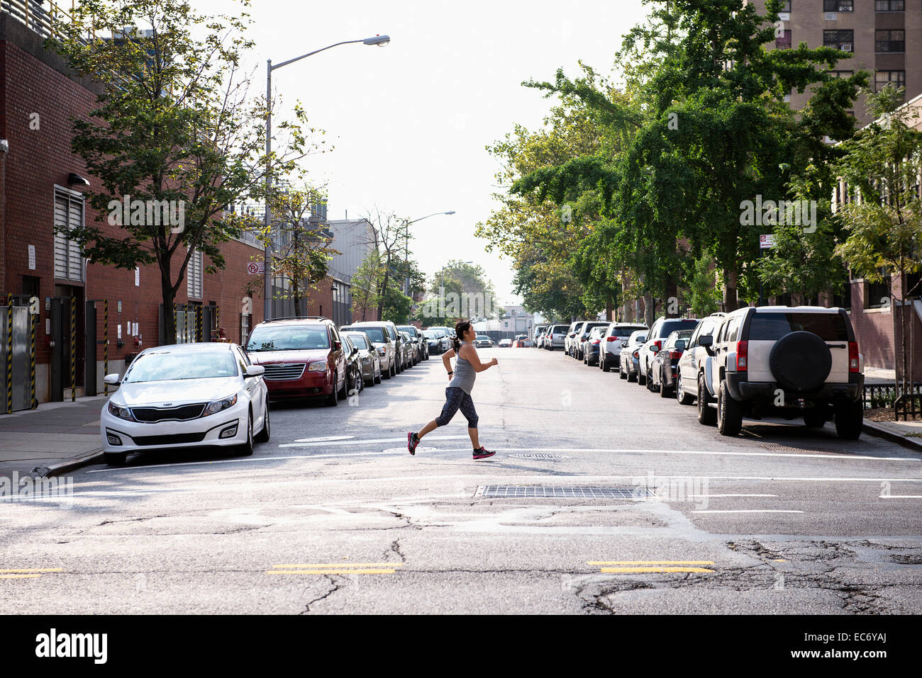 A woman running down the street in Manhattan Stock Photo - Alamy