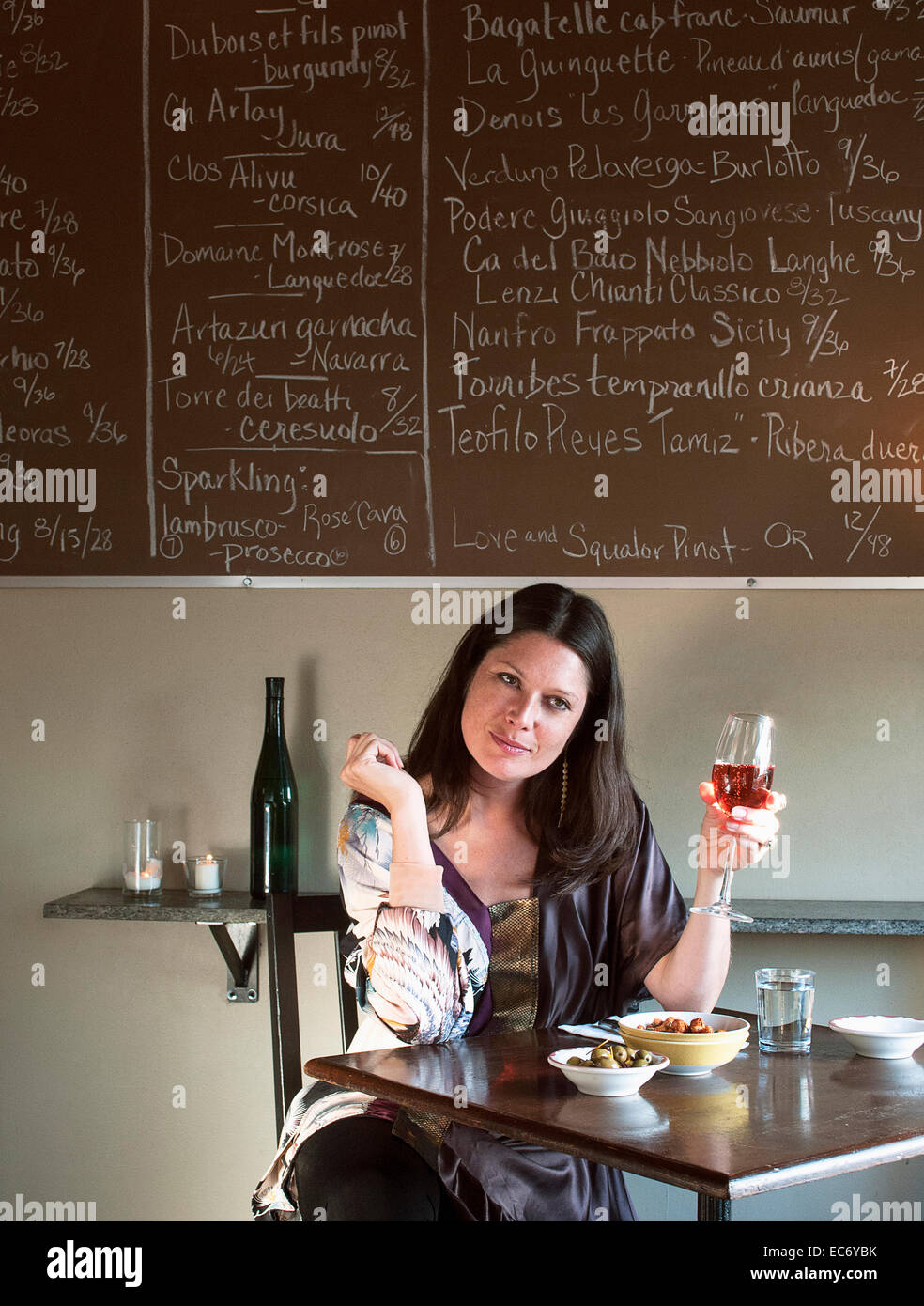 Woman holding glass of wine hi-res stock photography and images - Alamy