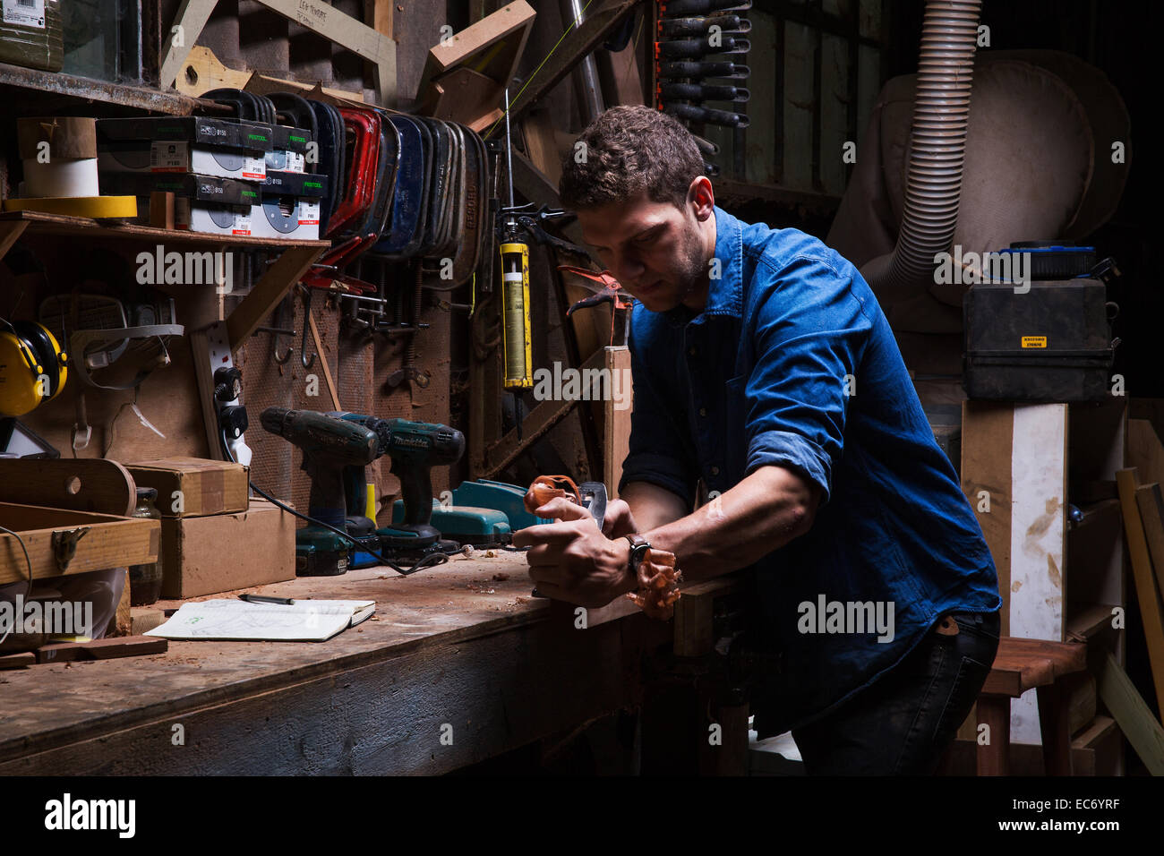 Image of a carpenter at work. London, England. July 2014. Stock Photo