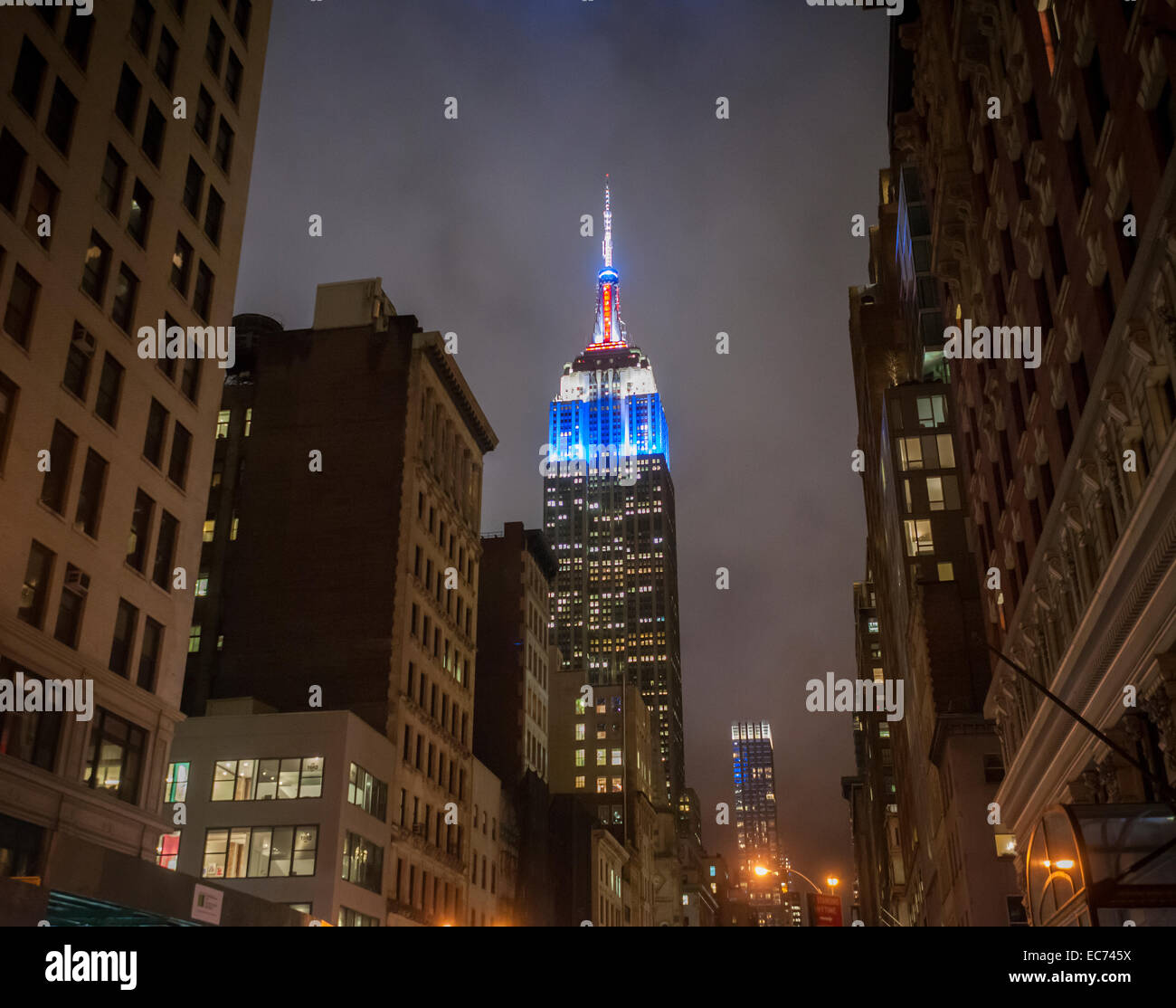New York, USA. 09th Dec, 2014. The Empire State Building in New York is lit up in the colors of the Union Jack on Tuesday, December 9, 2014 in honor of the visit of the Duke and Duchess of Cambridge to New York. The Royal couple visited the iconic attraction earlier in the day. Credit:  Richard Levine/Alamy Live News Stock Photo