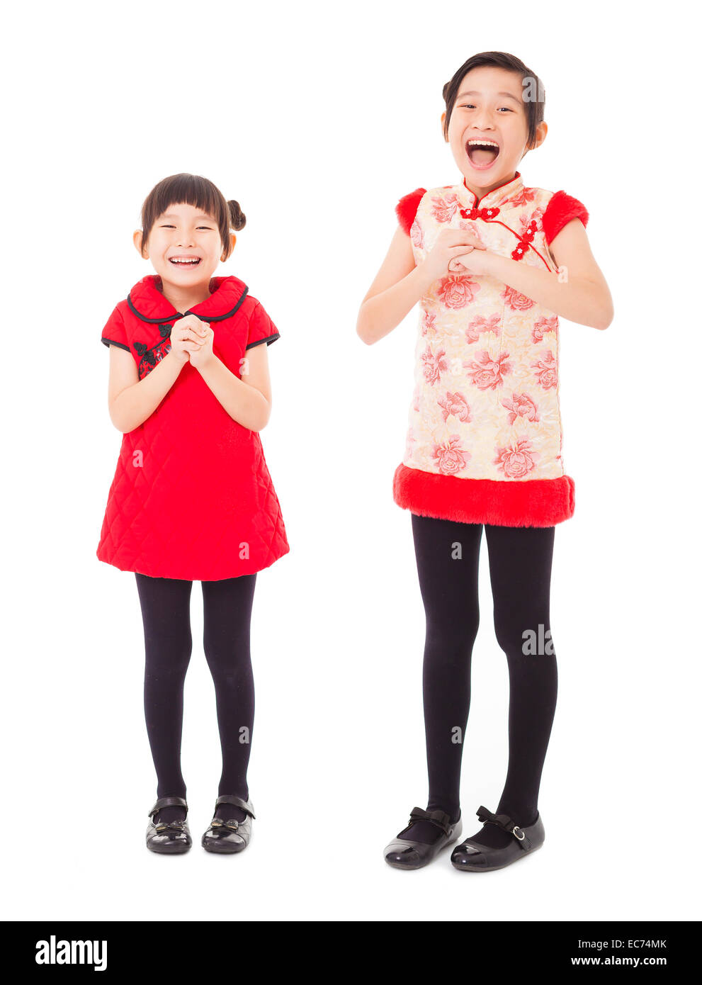 happy chinese new year. smiling little girls with congratulation gesture Stock Photo