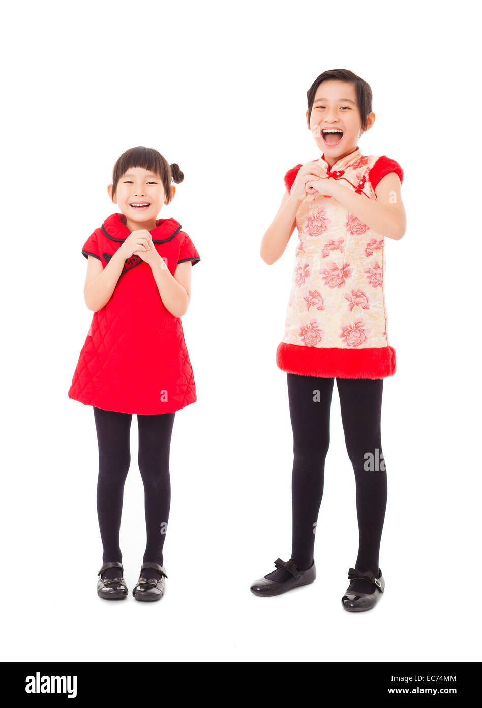 happy chinese new year. smiling little girls with congratulation gesture Stock Photo