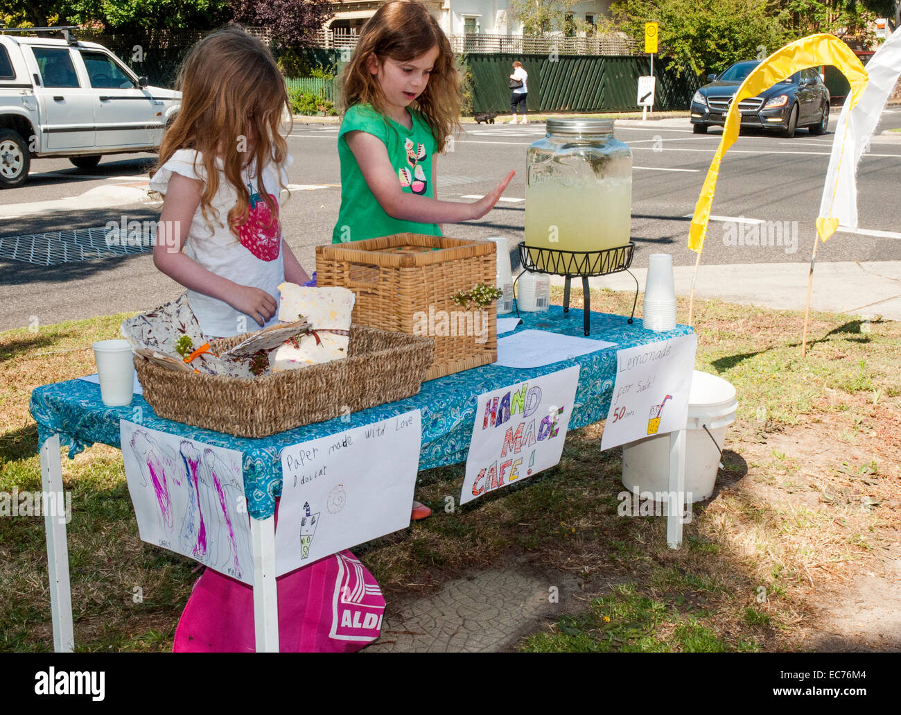Children selling lemonade outside an election polling booth, Melbourne, Australia Stock Photo