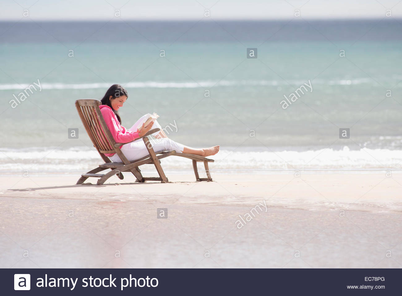 Woman Sitting In Beach Chair Stock Photos & Woman Sitting In Beach