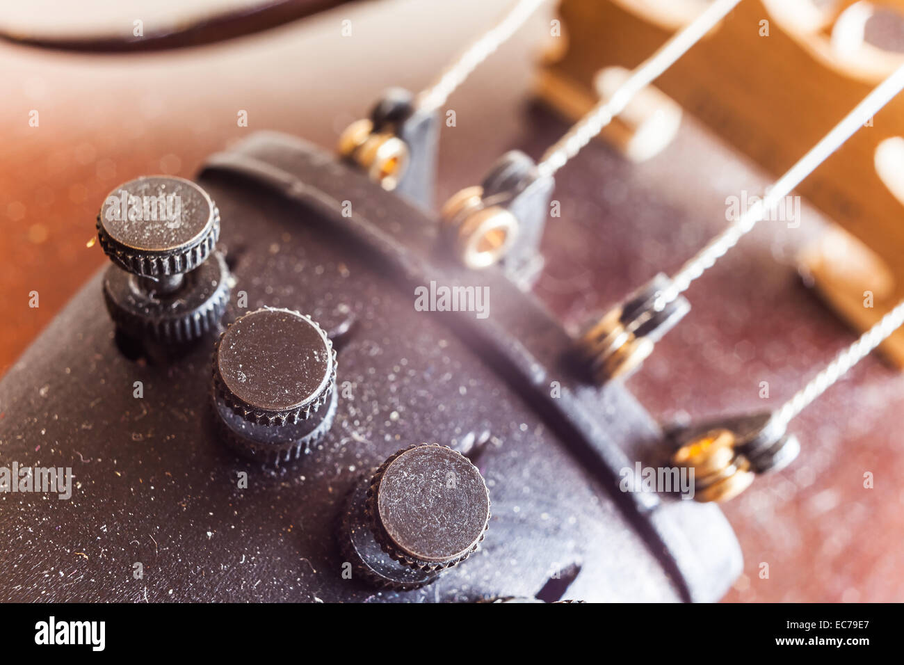 Micro tuners on violin for precise tuning, macro view. Stock Photo