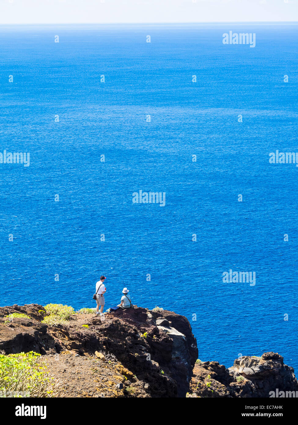 Spain, Canary Islands, La Palma, tourists at the cliff coast of Garafia Stock Photo