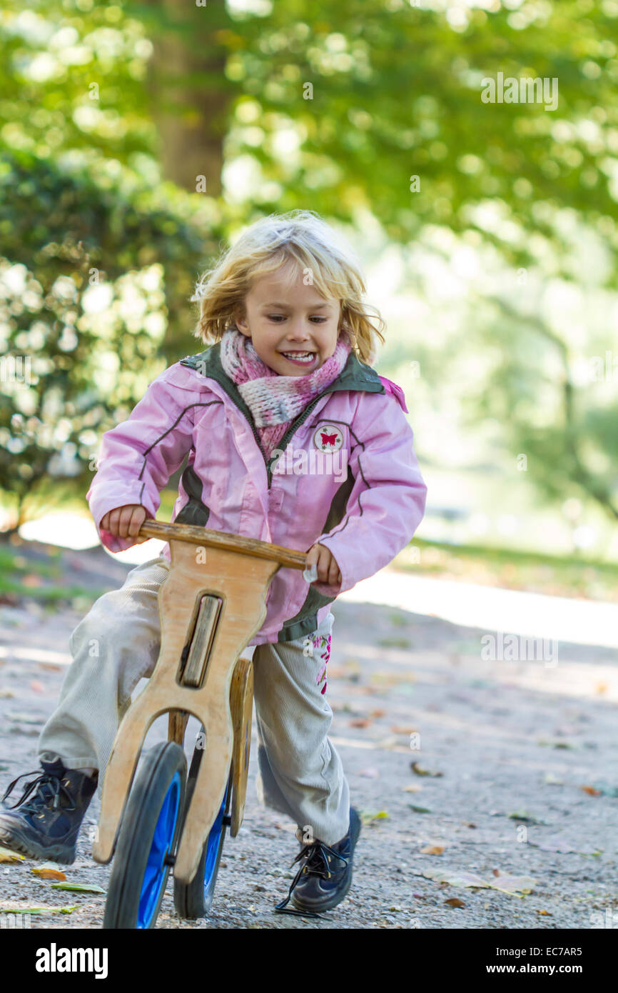 Little girl driving on balance bicycle Stock Photo Alamy