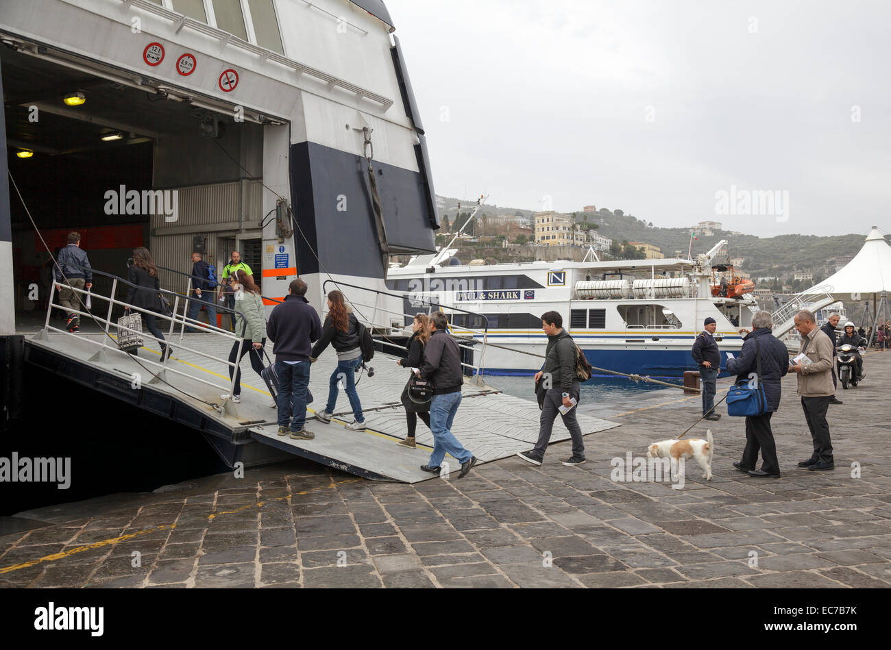 people walking onto a car ferry, Sorrento, Campania, Italy Stock Photo