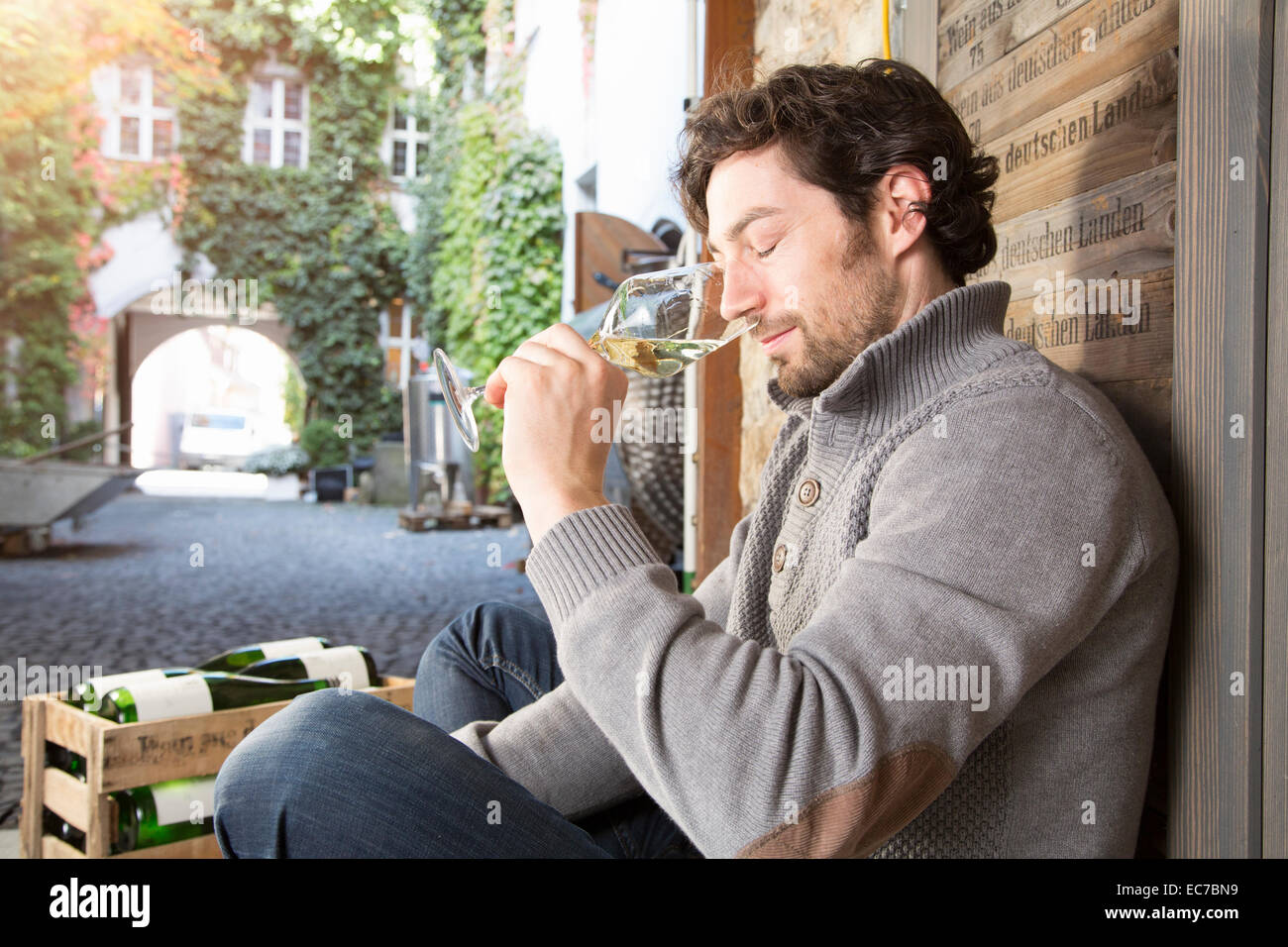 Man tasting wine at wine estate Stock Photo - Alamy