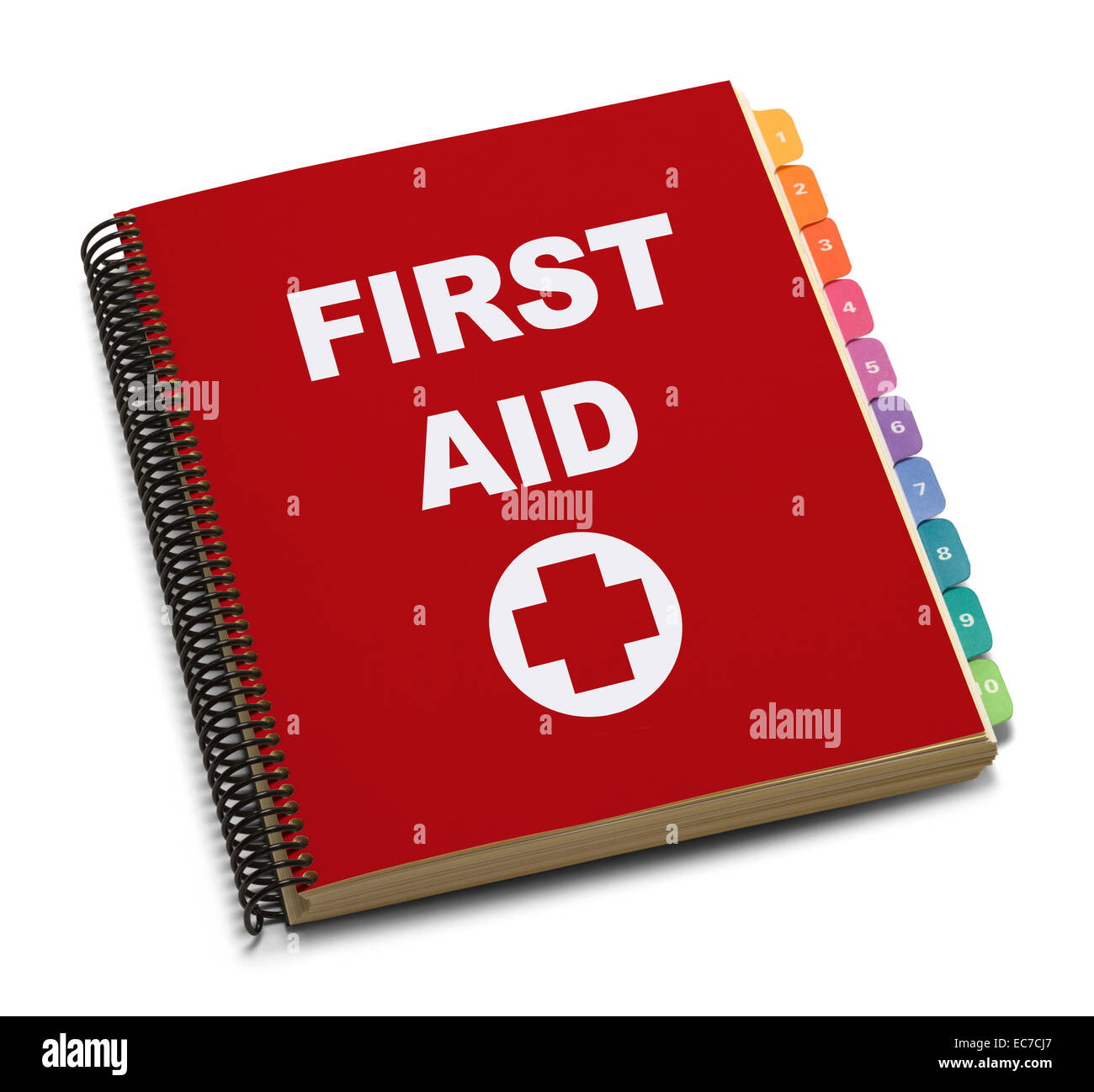 Red Spiral Bound First Aid Handbook Isolated on White Background. Stock Photo